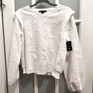 White, long sleeve INC top. Textured, washed white shirt for casual or dressy.